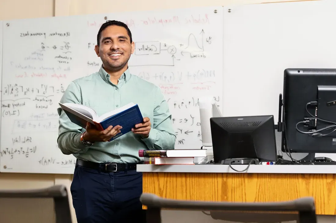 Portrait of professor Victor Duenas in lab.